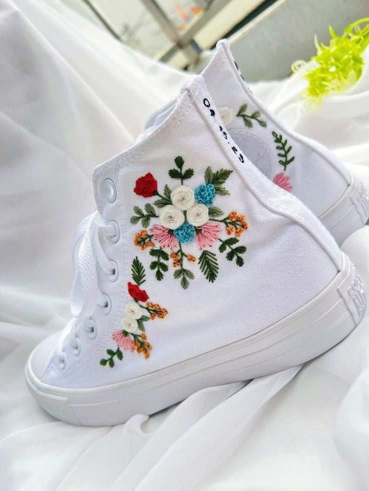 White embroidered tennis shoes