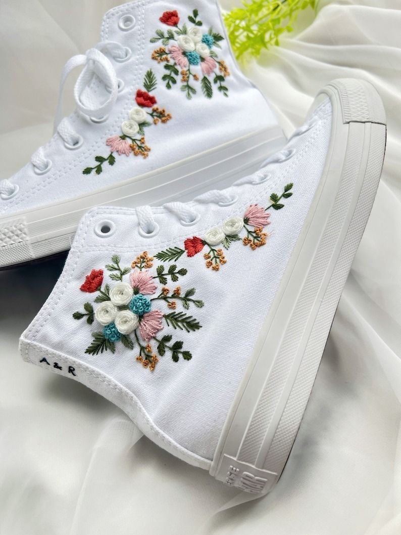 White embroidered tennis shoes