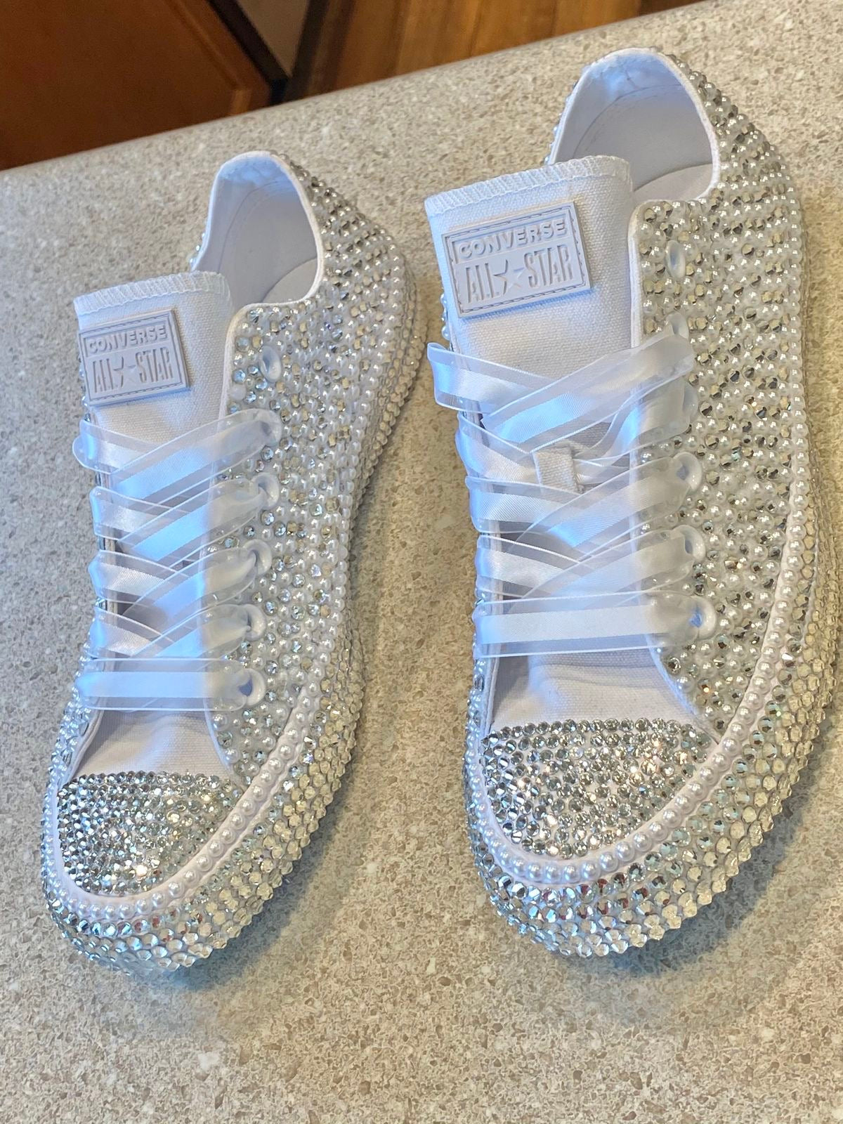 Tennis shoes decorated with silver crystals