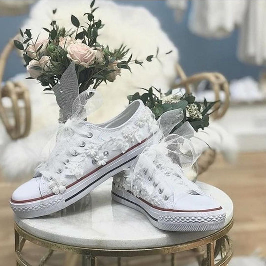 White tennis shoes with flowers for wedding