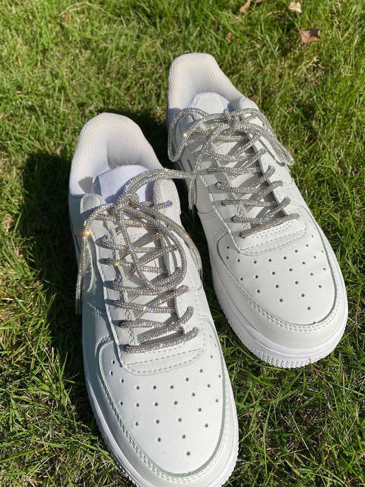 White tennis shoes with crystal laces